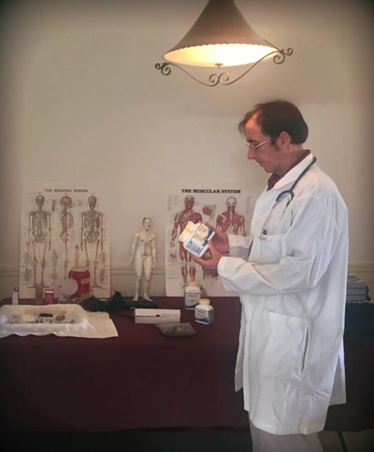 Dr. De Puigdorfila reviewing medical materials in his clinic